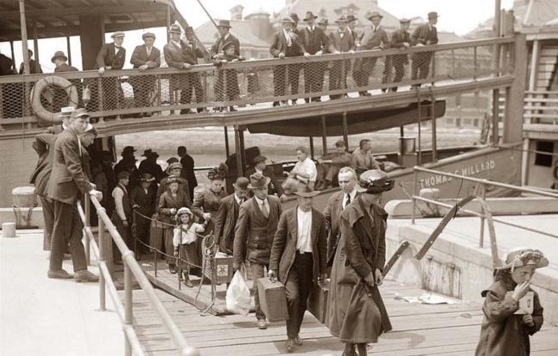 Immigrants landing in Ellis Island all with different surnames and backgrounds